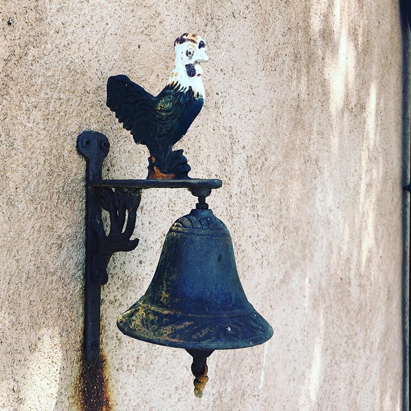 Rooster on a bell